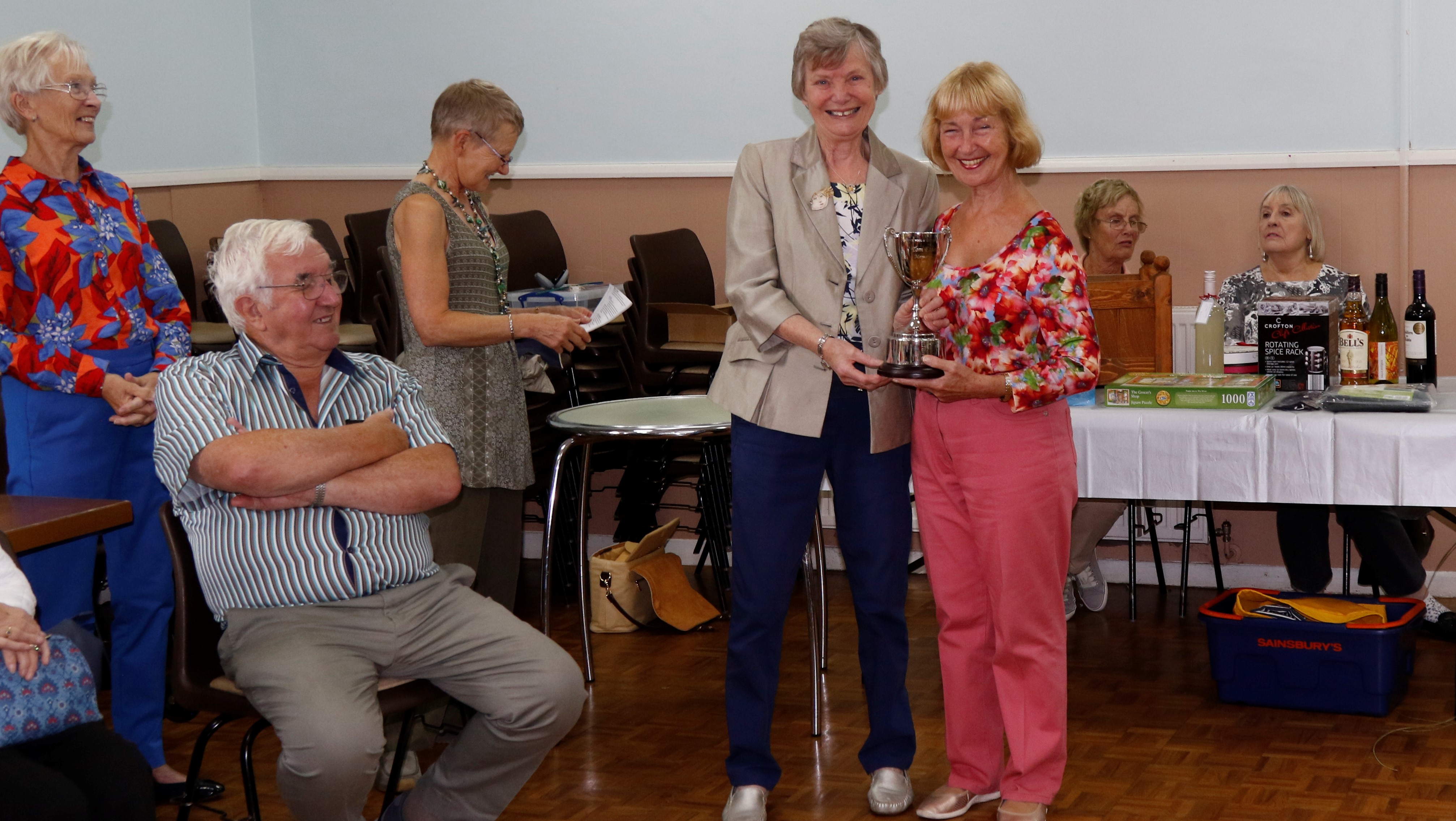 Ivy Evans presenting Ethestone Trophy to June Morris
