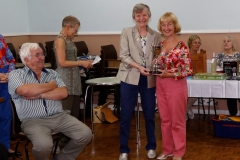 Ivy Evans presenting Ethestone Trophy to June Morris